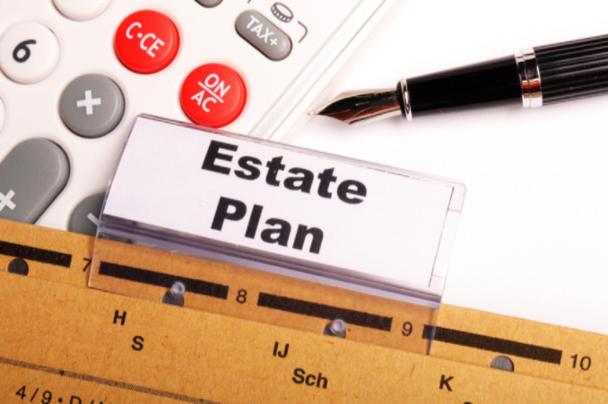 Estate plan with pen and calculator: WorkingManLaw Estate Planning Blog