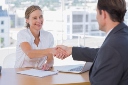 Interviewee shaking employer’s hand: WorkingManLaw Employment Law Blog