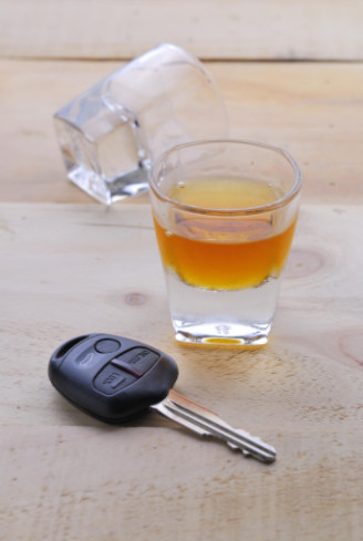 Alcohol and car key on table: WorkingManLaw Car Accidents Blog