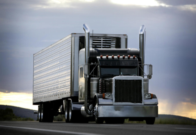 Semi-truck at sunset: Working Man Law Car Accidents Blog
