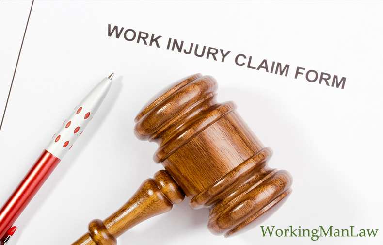 pen and gavel on top of a workplace injury form